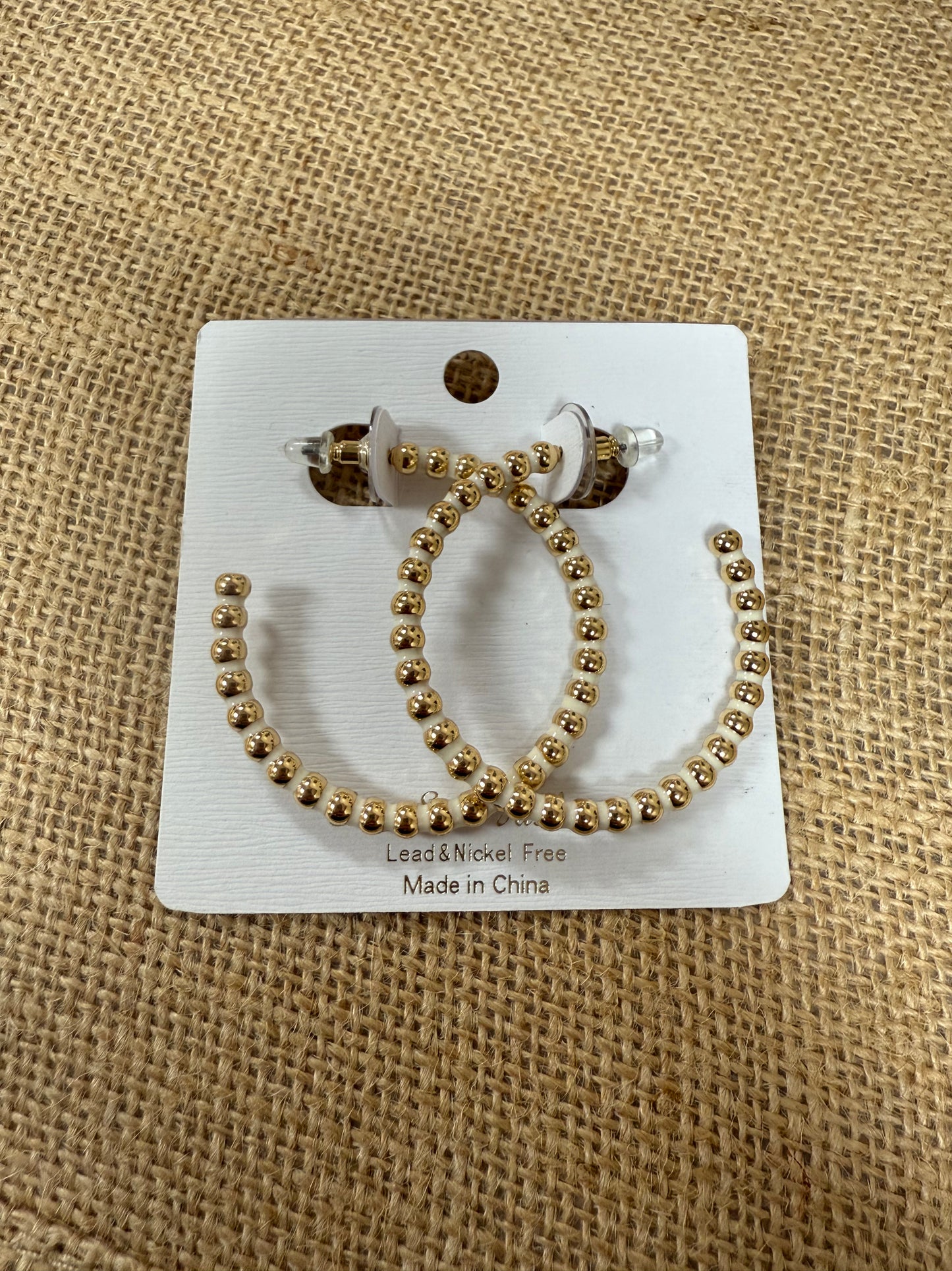 White & gold hoop earrings