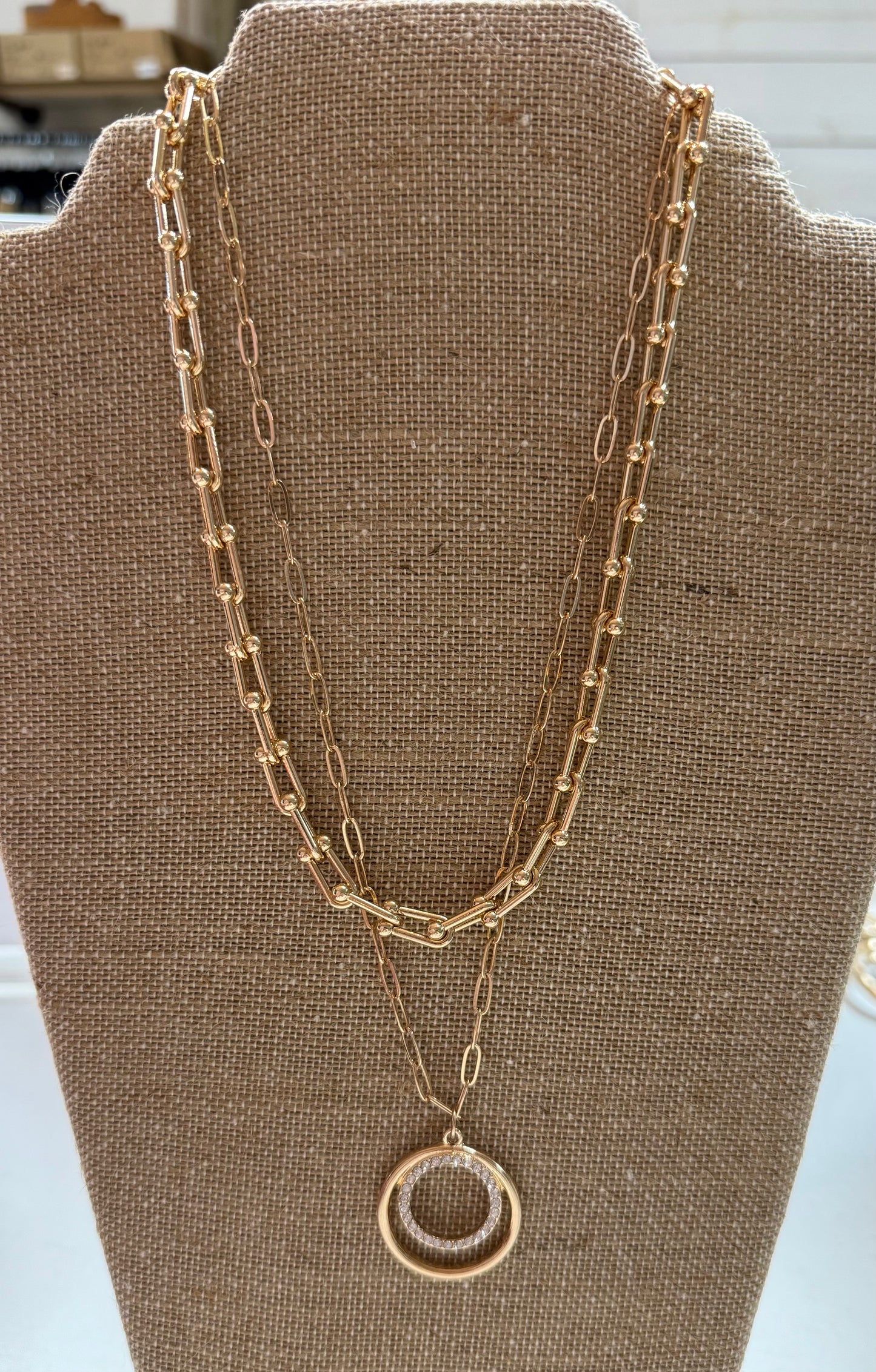 Gold multi chain circle necklace