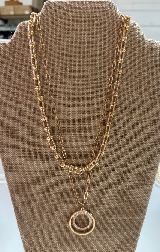 Gold multi chain circle necklace